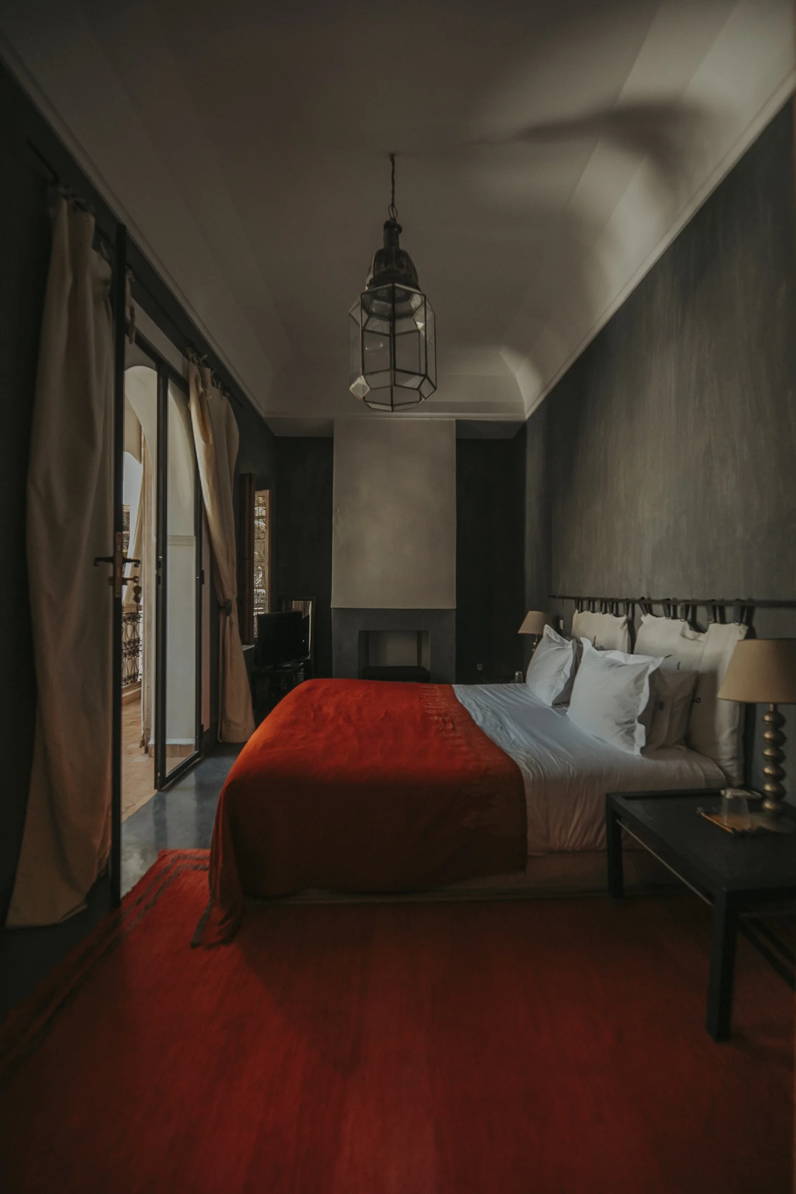 The Carbone Deluxe Room at Dar Zelda, in charcoal tones with a fireplace — view 4