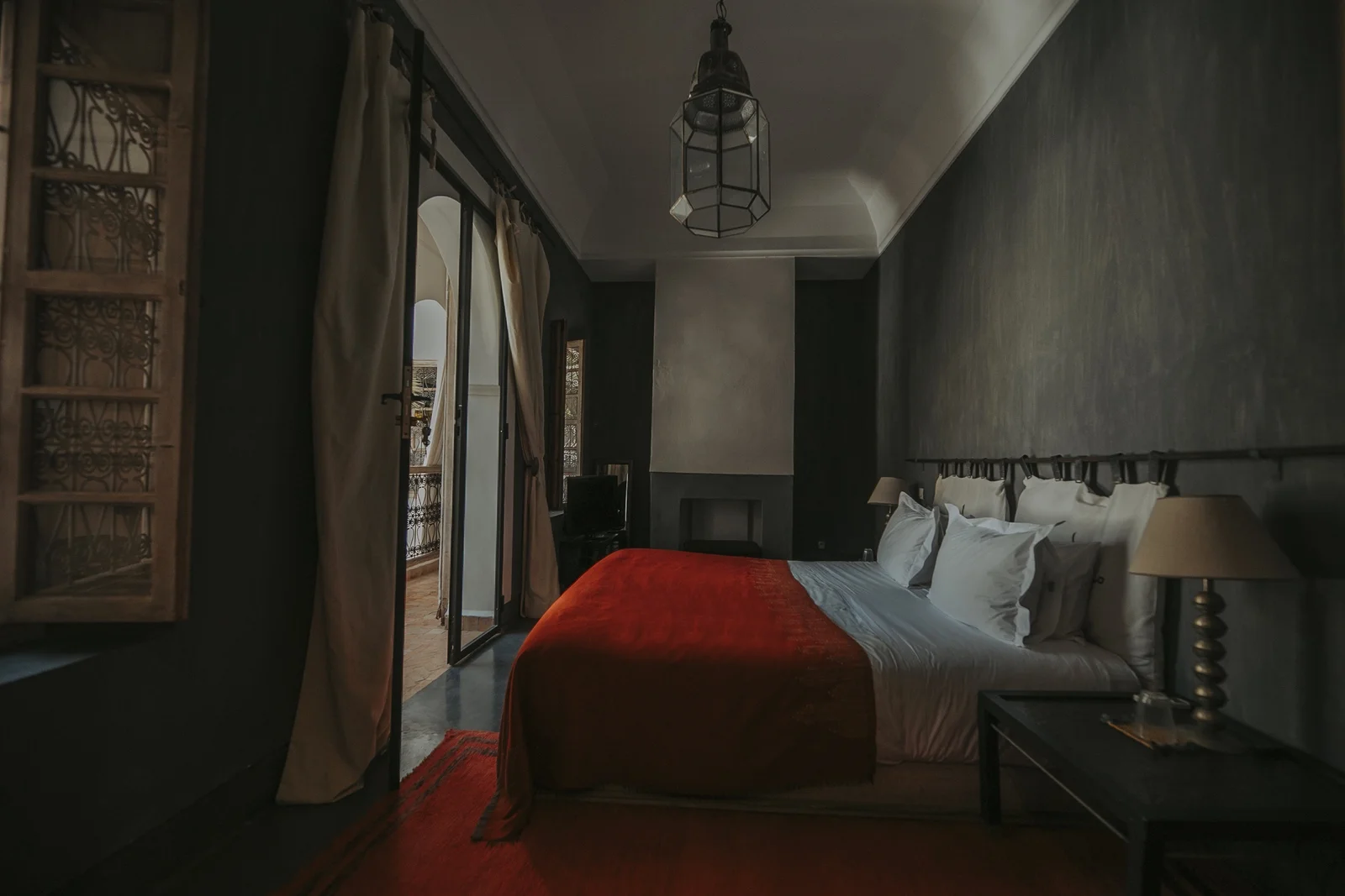The Carbone Deluxe Room at Dar Zelda, in charcoal tones with a fireplace — view 5