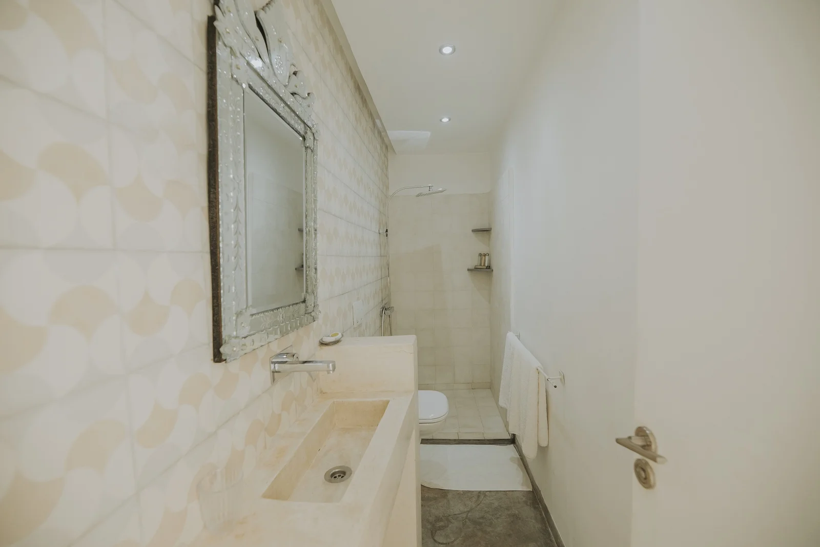 The Loft Suite at Dar Zelda, with its bare stone wall and exposed beams — view 5