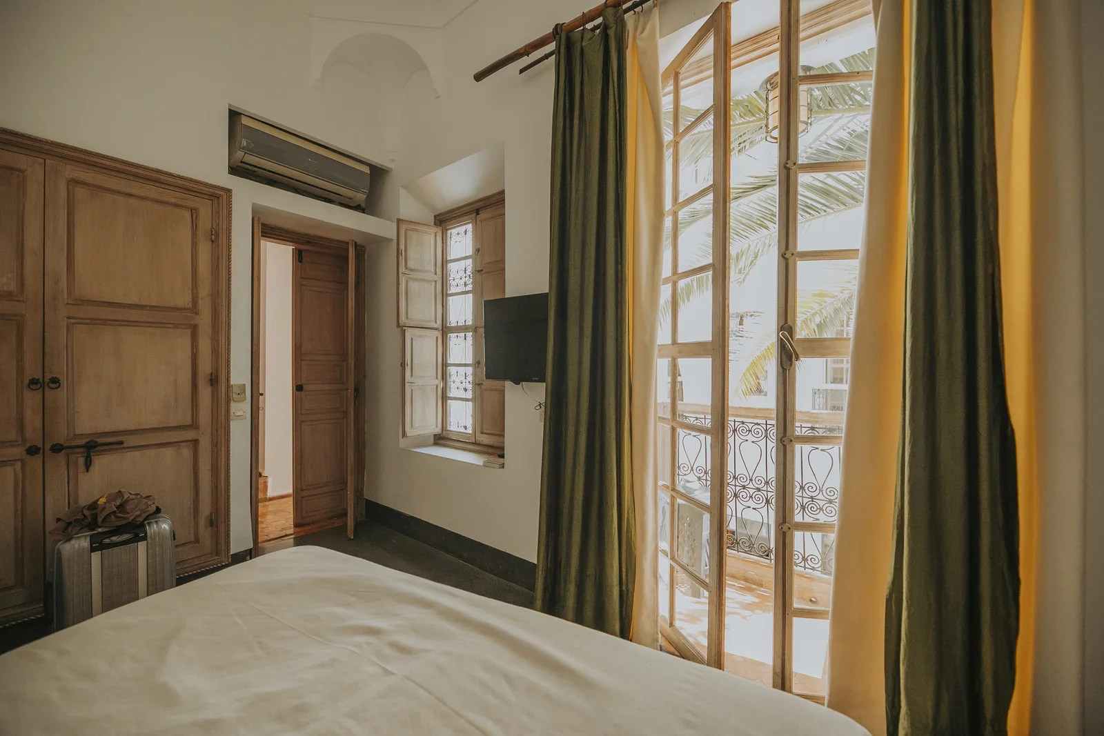 The Vegetale Standard Room at Dar Zelda and its balcony over the flowering courtyard — view 3